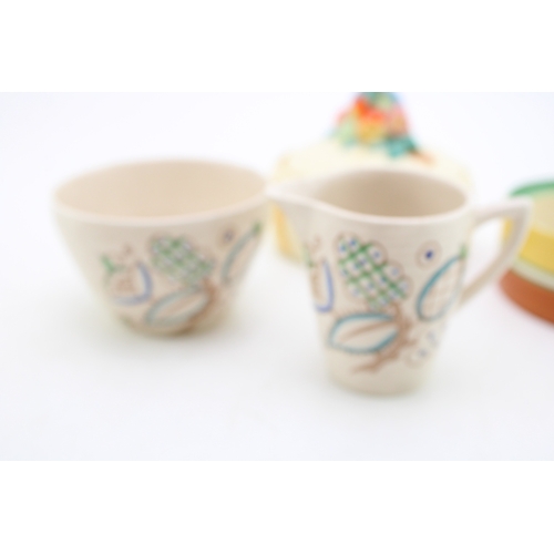 351 - Clarice Cliff to include a Celtic Harvest lidded jar, a Crocus base with a Wilkinson milk and sugar ... 