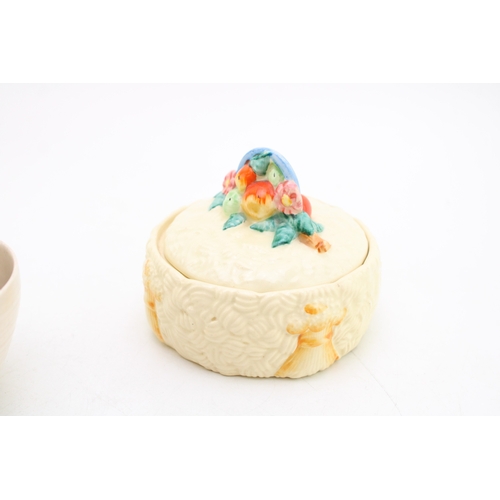 351 - Clarice Cliff to include a Celtic Harvest lidded jar, a Crocus base with a Wilkinson milk and sugar ... 