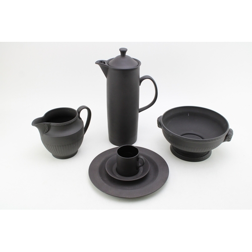 378 - Wedgwood Black Basalt porcelain to include a  Bowl with Ram terminals, Lidded Coffee Pot, Cup and Sa... 