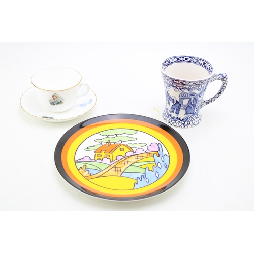 384 - Clarice Cliff by Wedgwood plate in the Orange Roof Cottage, a Doulton Burslem Diamond Jubilee 1897 c... 