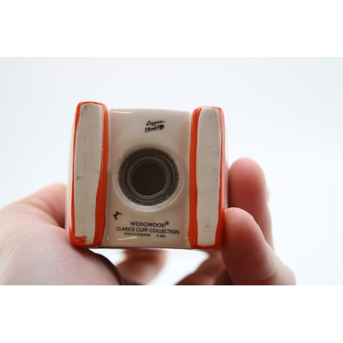 386 - Clarice Cliff by Wedgwood sugar shaker in the Red Tree design, 12.5cm tall.