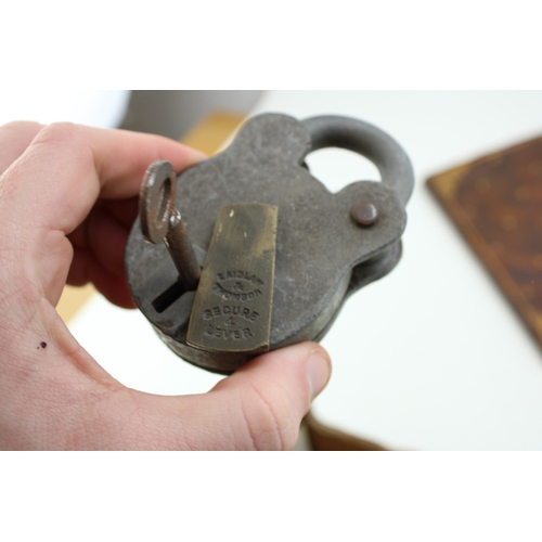 398 - Two vintage padlocks with keys by Laidlaw and Belfry together with a set of antique keys and a leath... 