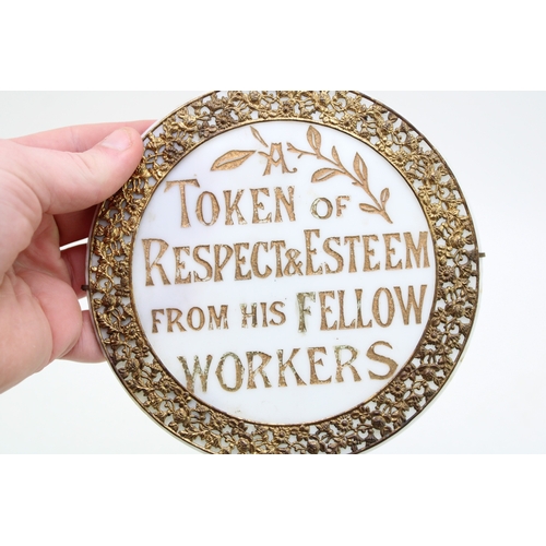 400 - An Edwardian glass roundel with gilt metal foliate decoration, 'A token of respect & esteem from his... 