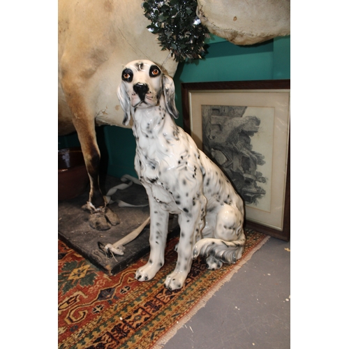 404 - A large lifesize pottery model of a dog, possibly a setter, 75cm tall, collection only.