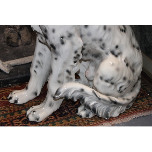 404 - A large lifesize pottery model of a dog, possibly a setter, 75cm tall, collection only.