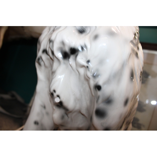 404 - A large lifesize pottery model of a dog, possibly a setter, 75cm tall, collection only.