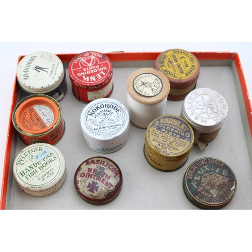 407 - A collection of early 20th century advertising tins and jars to include, Pflueger Hande-Par Fish Hoo... 