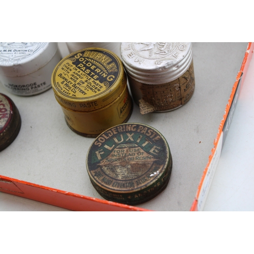 407 - A collection of early 20th century advertising tins and jars to include, Pflueger Hande-Par Fish Hoo... 