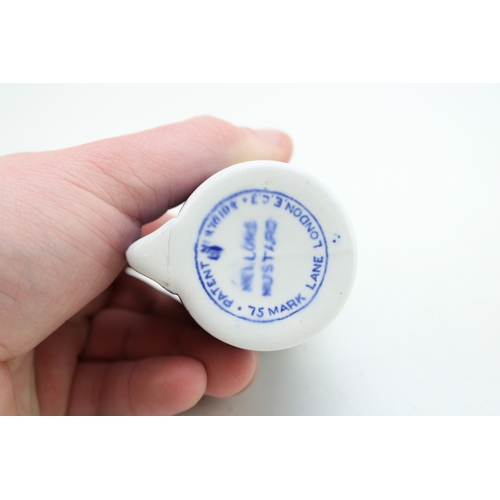 416 - Mellor's patent mustard pot, cylindrical form with vertical spout, copper lid and plunger with Press... 