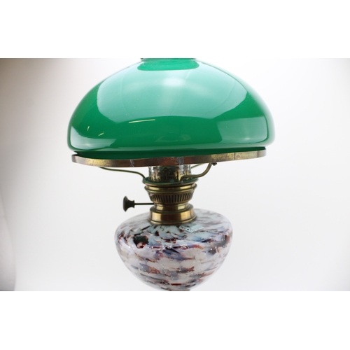 453 - Wizard oil lamp, made in Prussia, cast iron base, mottled glass bowl, green glass shade, 65cm tall.