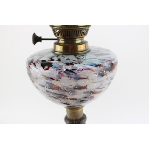 453 - Wizard oil lamp, made in Prussia, cast iron base, mottled glass bowl, green glass shade, 65cm tall.
