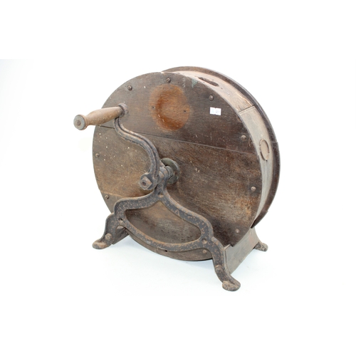 457 - A vintage knife sharpening tool on cast metal base, 40cm tall, 40cm wide.