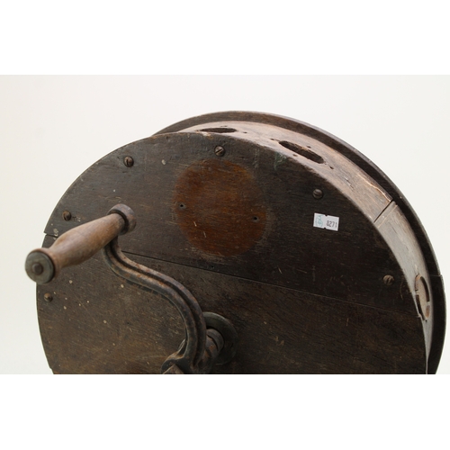 457 - A vintage knife sharpening tool on cast metal base, 40cm tall, 40cm wide.