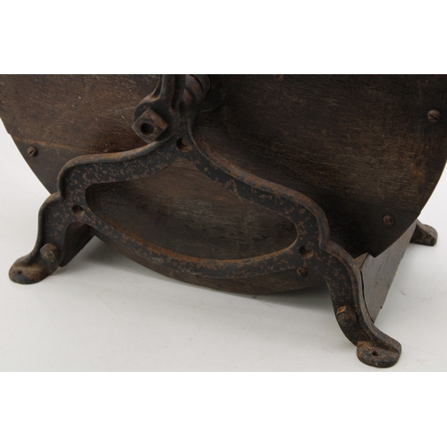 457 - A vintage knife sharpening tool on cast metal base, 40cm tall, 40cm wide.