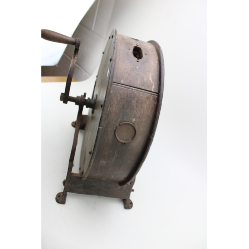 457 - A vintage knife sharpening tool on cast metal base, 40cm tall, 40cm wide.