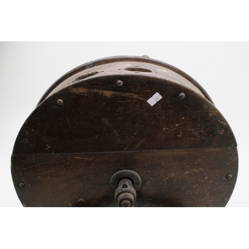 457 - A vintage knife sharpening tool on cast metal base, 40cm tall, 40cm wide.