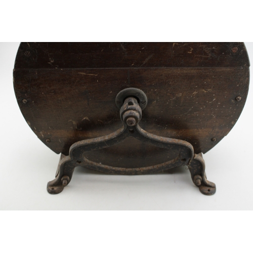 457 - A vintage knife sharpening tool on cast metal base, 40cm tall, 40cm wide.