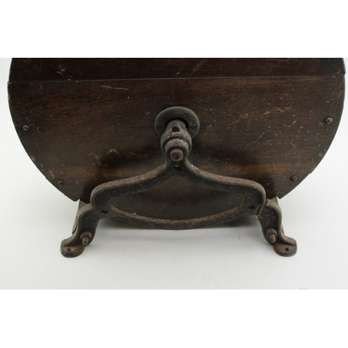 457 - A vintage knife sharpening tool on cast metal base, 40cm tall, 40cm wide.