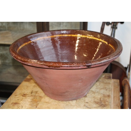 466 - An early 20th century farmhouse dairy bowl, also known as a pancheon or tian bowl, terracotta with g... 