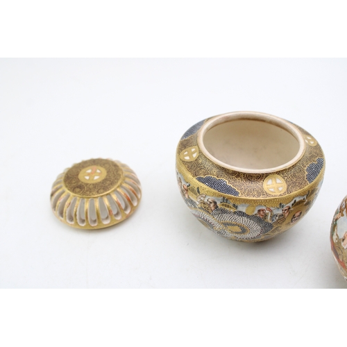 498 - Two Japanese Satsuma vases, one with lid and markings to base, 9cm tall.