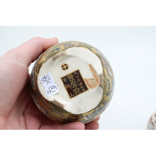 498 - Two Japanese Satsuma vases, one with lid and markings to base, 9cm tall.