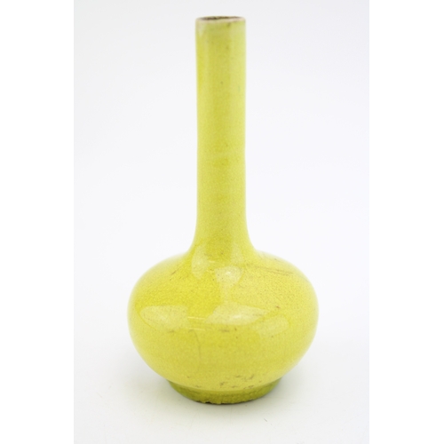 An antique Chinese yellow monochrome vase, with elongated neck, 9.5cm tall.