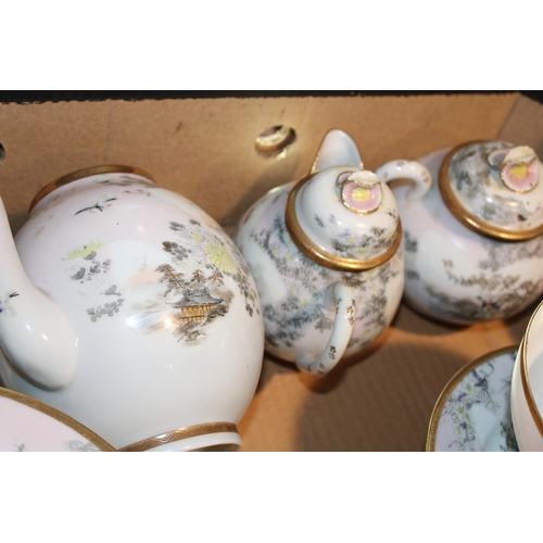 509 - An oriental export tea and coffee service to include teapots, cups, saucers and others (Qty).