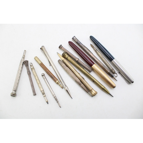 567 - Vintage fountain pens to include two Parker examples together with silver propelling pencils and oth... 