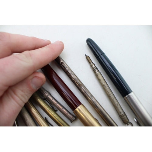 567 - Vintage fountain pens to include two Parker examples together with silver propelling pencils and oth... 