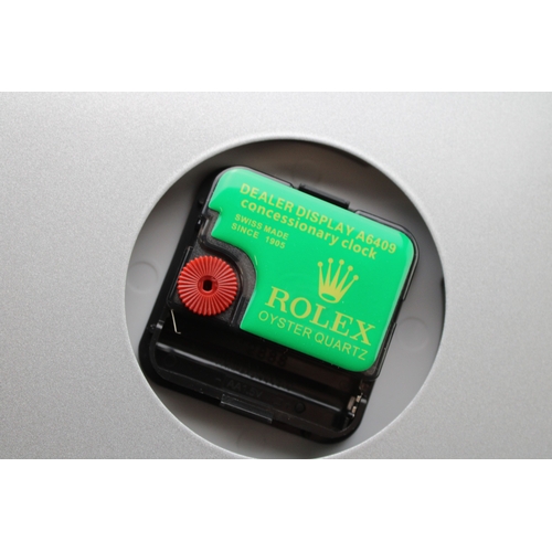 573 - A large dealership clock, in the style of an Oyster Perpetual Datejust, 34cm diameter.