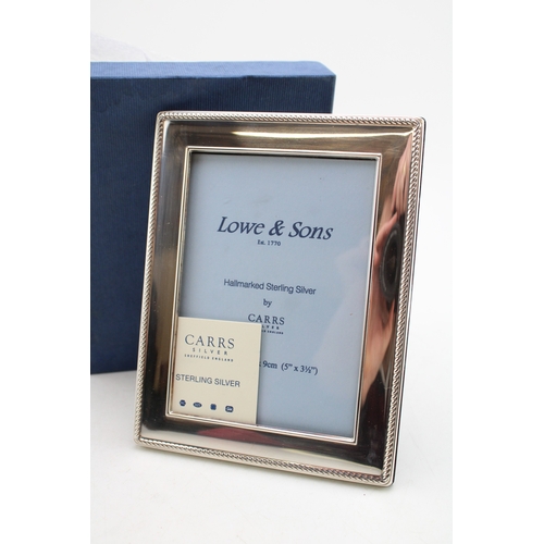 579 - Boxed sterling silver photo frame, by Carrs of Sheffield 2007, 13cm tall.