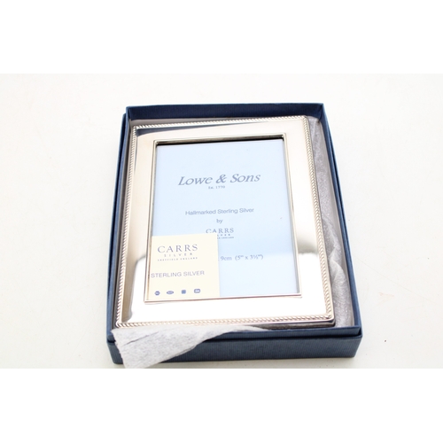 579 - Boxed sterling silver photo frame, by Carrs of Sheffield 2007, 13cm tall.
