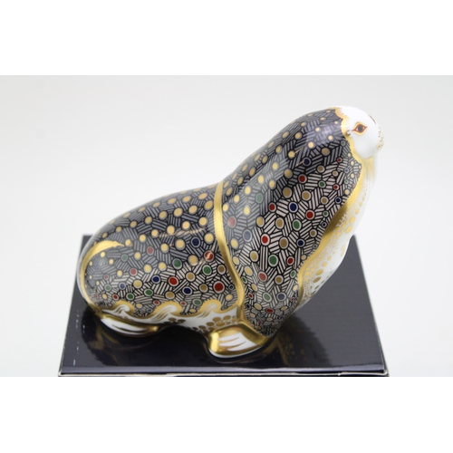 58 - Boxed Royal Crown Derby paperweight of a Russian Walrus, first quality with gold stopper.