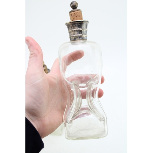 583 - Near pair of Victorian 'glug glug' decanters with silver plated collars, 23cm tall, (2).