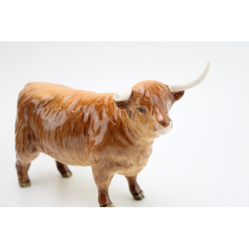 85 - Beswick Highland Cattle family to include a cow, a bull and a calf (two af - 3).