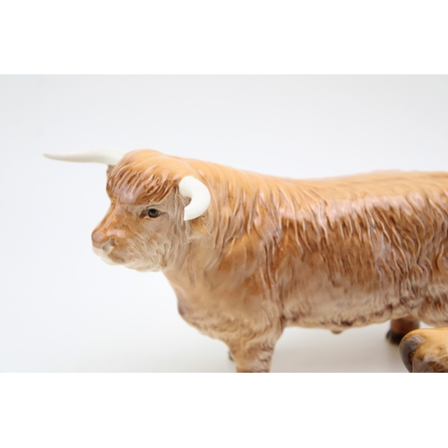 85 - Beswick Highland Cattle family to include a cow, a bull and a calf (two af - 3).