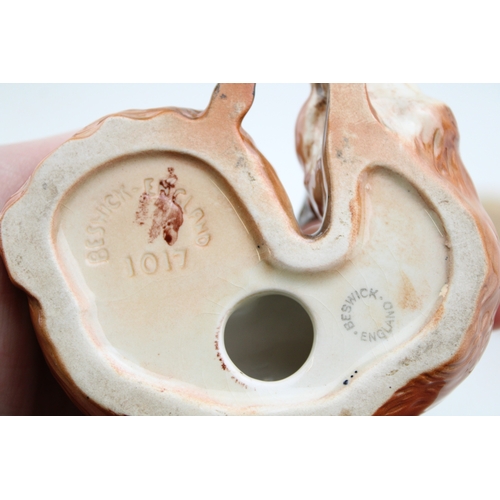 87 - Beswick to include three rabbits, a matt brown Shetland foal, an early painted curled fox 1017, a de... 