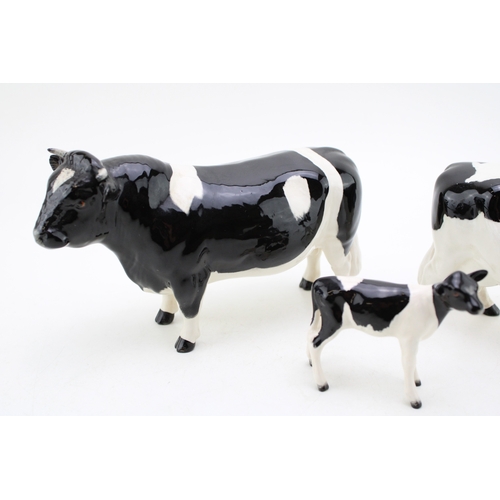 90 - Beswick Friesian cattle family to include the cow, the bull and the calf (3).
