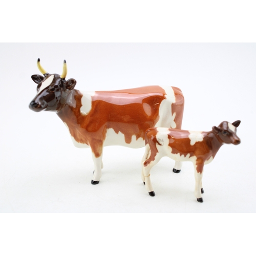 93 - A Beswick Ayreshire cow with an Ayrshire calf (2- calf's leg af).