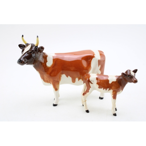 93 - A Beswick Ayreshire cow with an Ayrshire calf (2- calf's leg af).