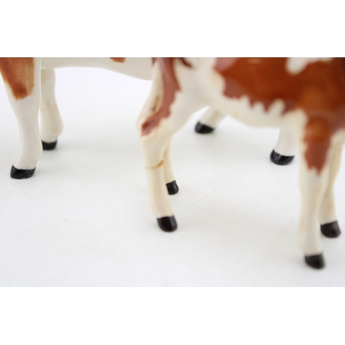 93 - A Beswick Ayreshire cow with an Ayrshire calf (2- calf's leg af).