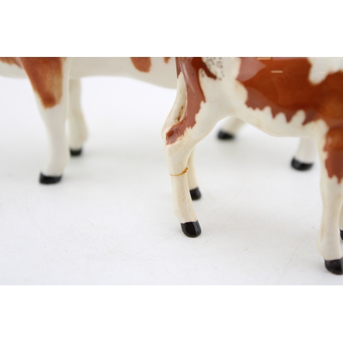 93 - A Beswick Ayreshire cow with an Ayrshire calf (2- calf's leg af).