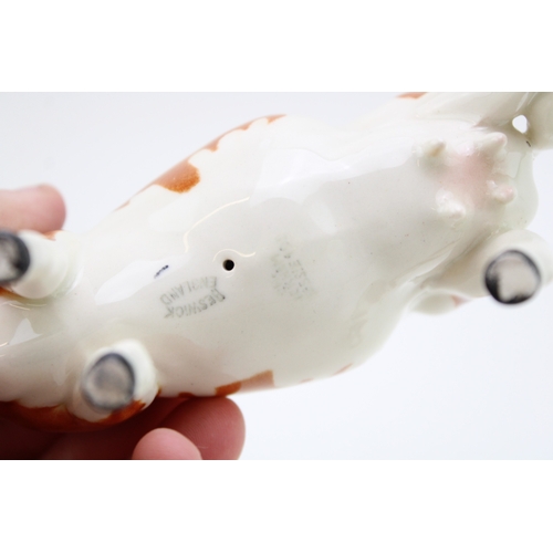 93 - A Beswick Ayreshire cow with an Ayrshire calf (2- calf's leg af).