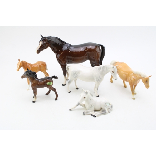 99 - Beswick to include a palomino boy's pony (restored), a lying 915 in grey, with other horses and foal... 