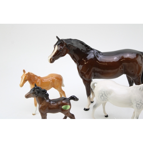 99 - Beswick to include a palomino boy's pony (restored), a lying 915 in grey, with other horses and foal... 