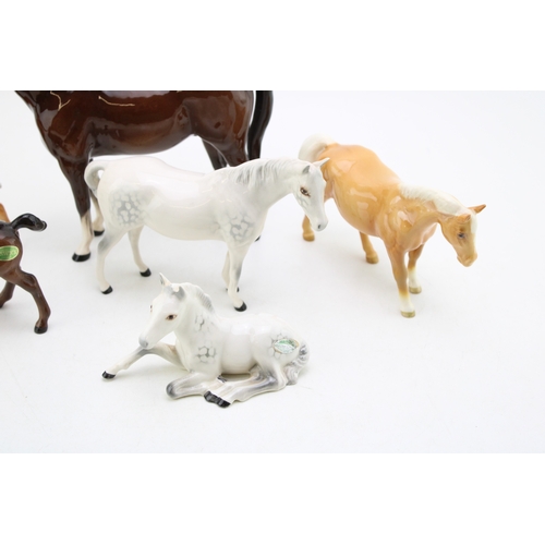 99 - Beswick to include a palomino boy's pony (restored), a lying 915 in grey, with other horses and foal... 