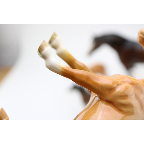 99 - Beswick to include a palomino boy's pony (restored), a lying 915 in grey, with other horses and foal... 