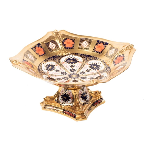 Royal Crown Derby 1128 Imari pattern Dolphin footed bowl, raised on a spreading square foot, pink printed factory mark to base, height 14.5cm.