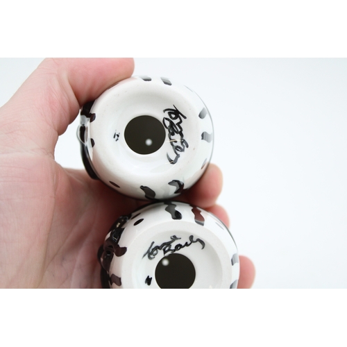 204 - A pair of Lorna Bailey Easter egg shape cruets, in the polka dots and bow design, 7.5cm tall (2).