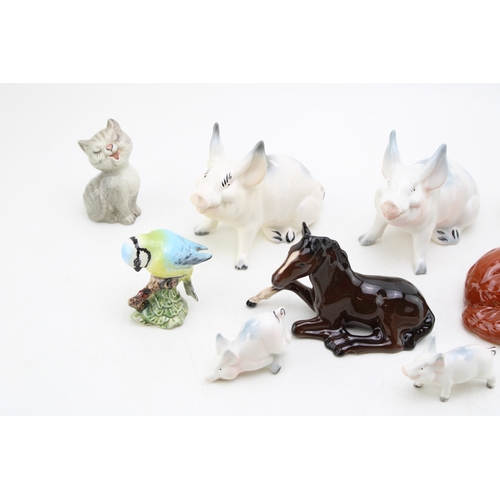 254 - Beswick animals to include a comical pig family, a blue tit, a laughing cat with mouse and others (Q... 